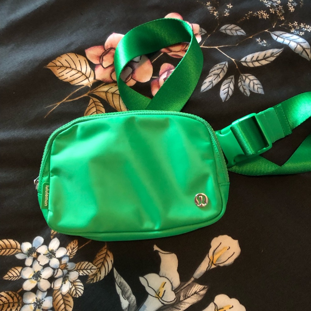 lululemon bright green waist pack with silver logo